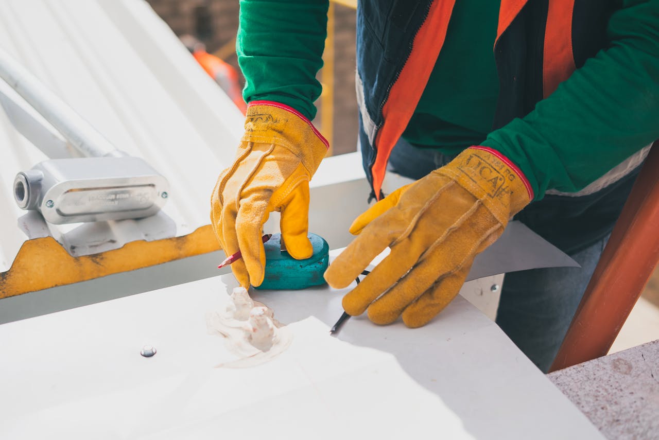 pexels-photo-8853523 Person Wearing Yellow Protective Gloves